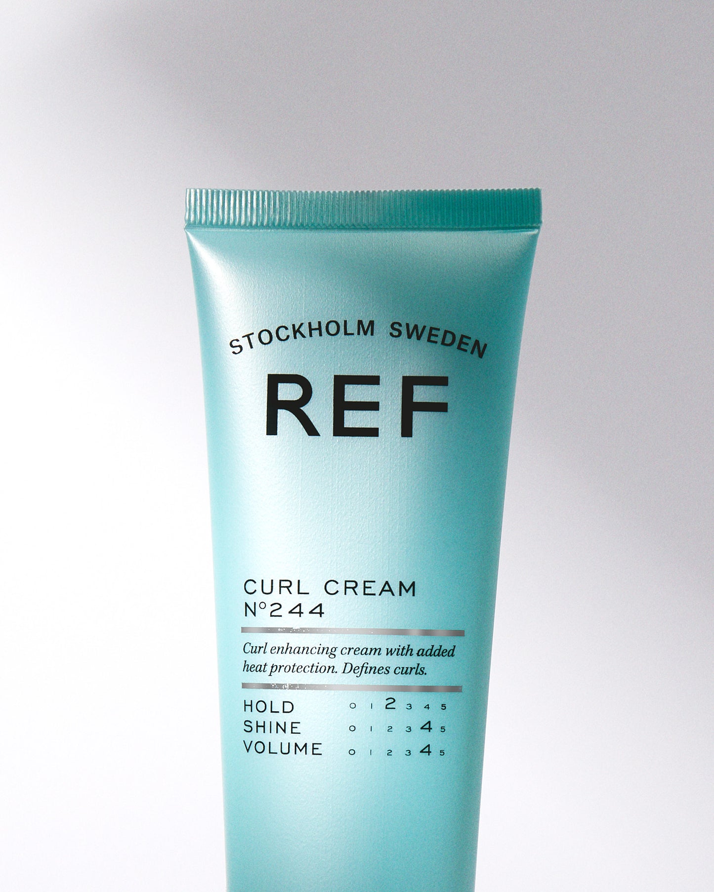 Lifestyle image of REF Stockholm tube of Curl Cream N°244 150ml