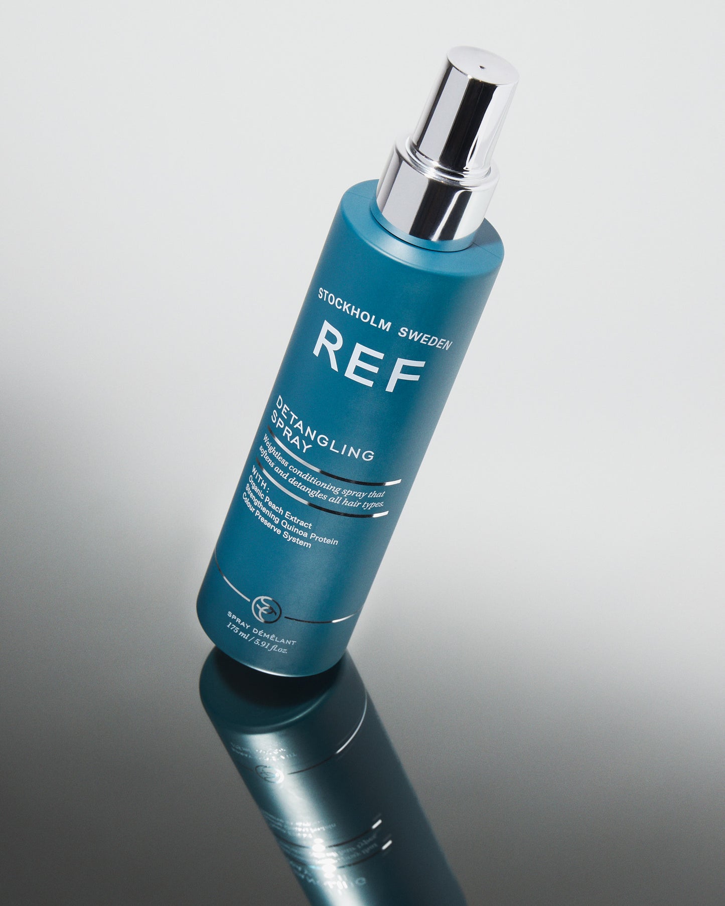 Lifestyle image of REF Stockholm Bottle of Detangling Spray 175ml