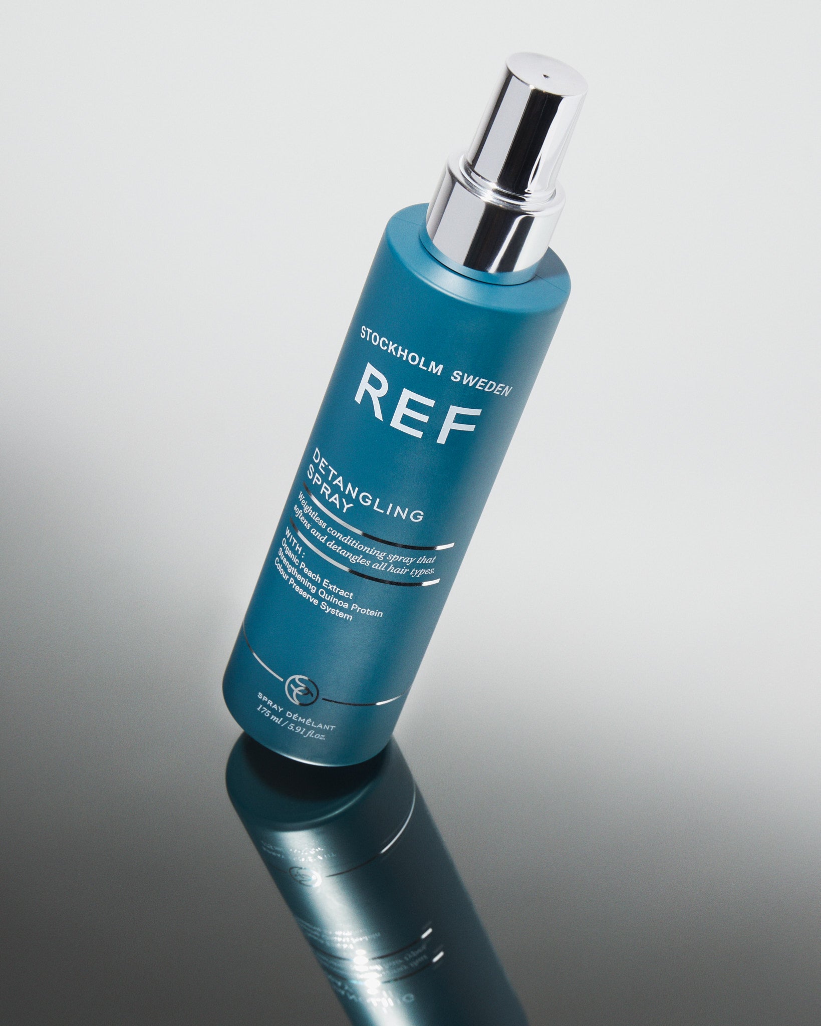 Lifestyle image of REF Stockholm Bottle of Detangling Spray 175ml